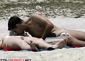 A couple of insolent nudists on the beach